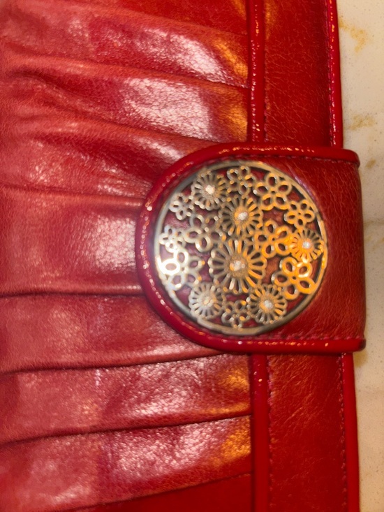 Brighton Red leather wallet featuring a decorative silver-toned snap closure. - Picture 14 of 16